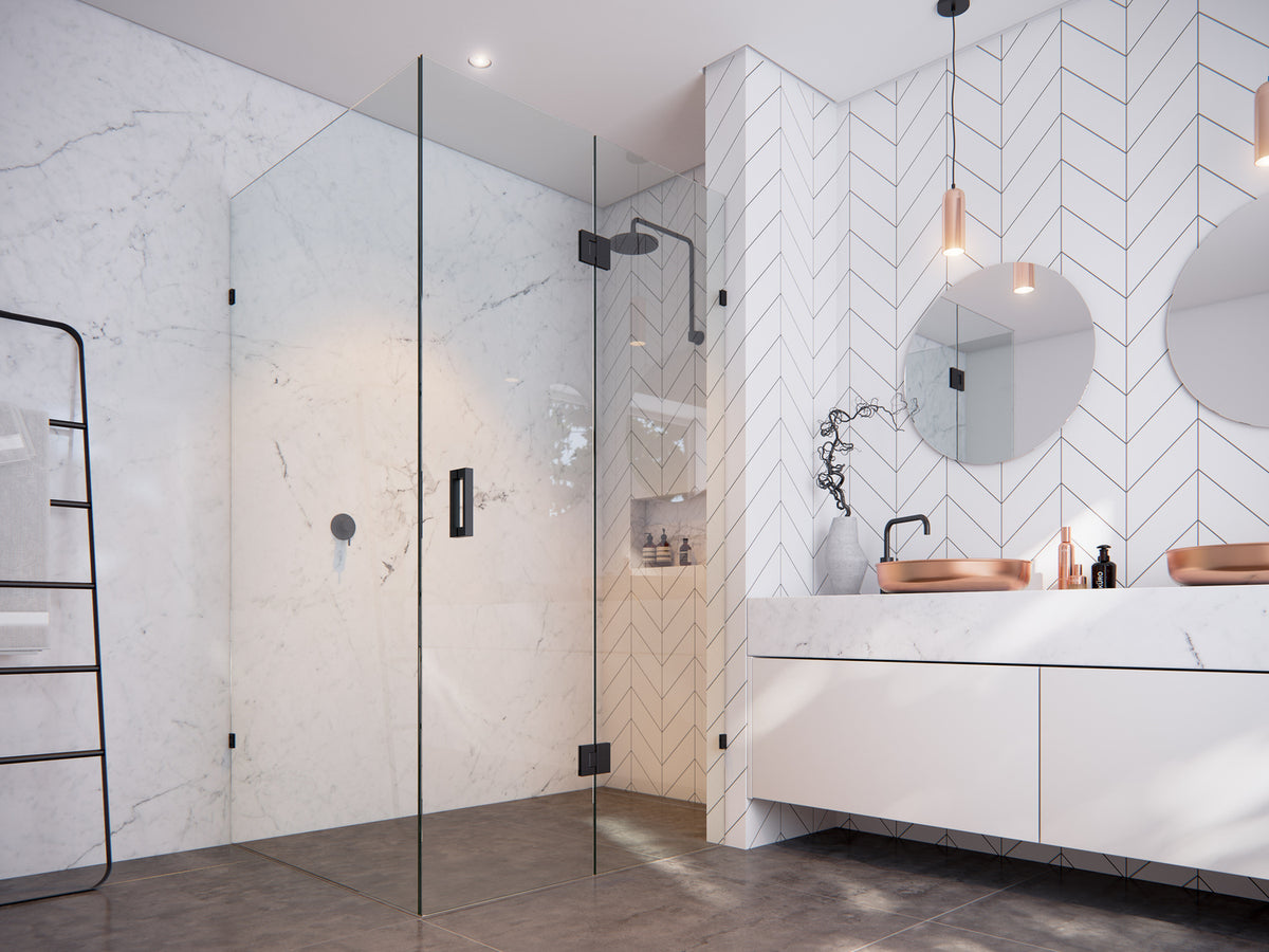 Modern bathroom with glass shower enclosure, white tiles, and vanity.
